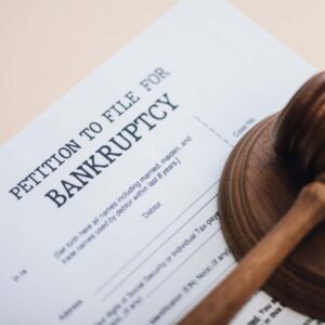 Bankruptcy petition form with judge’s gavel, symbolizing filing for bankruptcy in Arizona in 2025